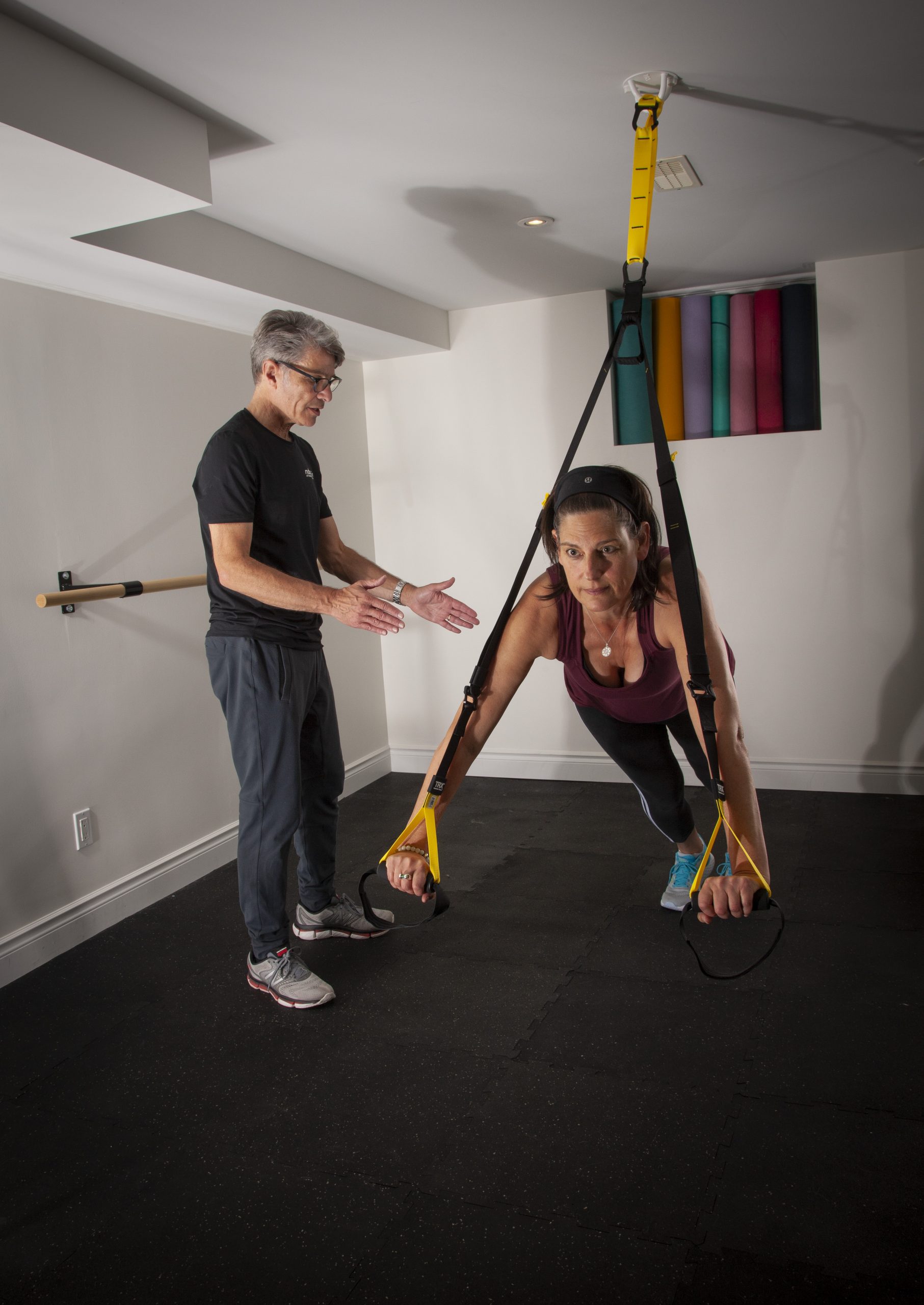 Neil encouraging a client during a TRX training session